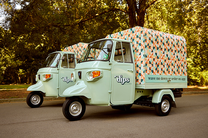 Must go restaurants: Dips Kitchen. Image of light blue retro van with chevron pattern on the back. Mobile dip delivery business.