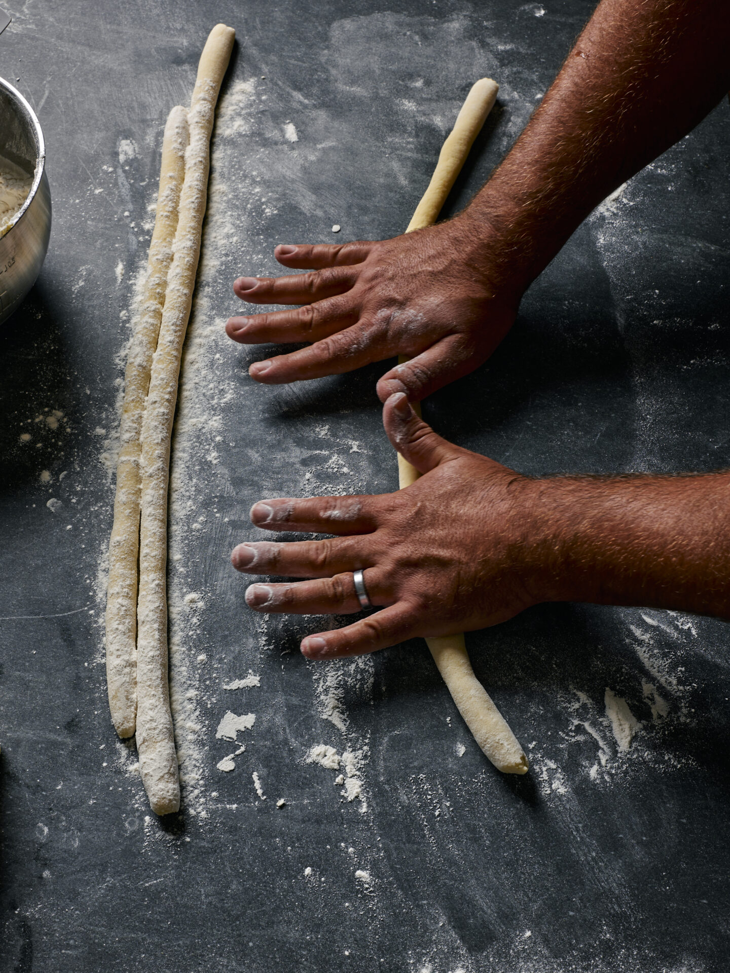 rolling out gnocchi dough
