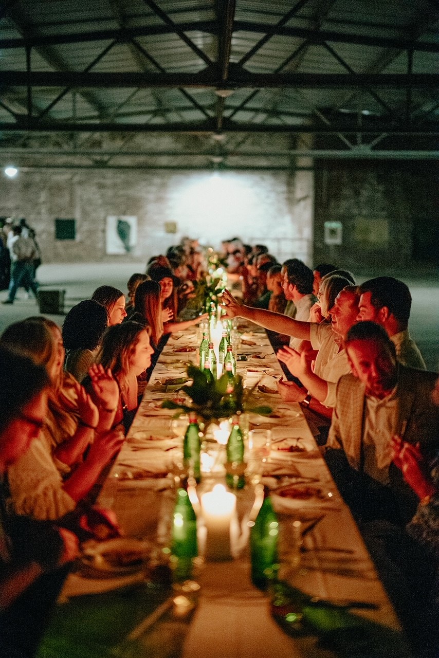 A long table filled with guests at the Etowah Dinner Series