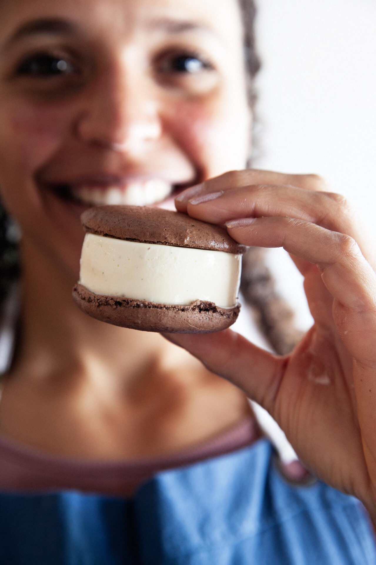 Owner Emily Harpster holding up an ice cream sandwich from SugarBear Ice Cream in Charlottesville, Virginia