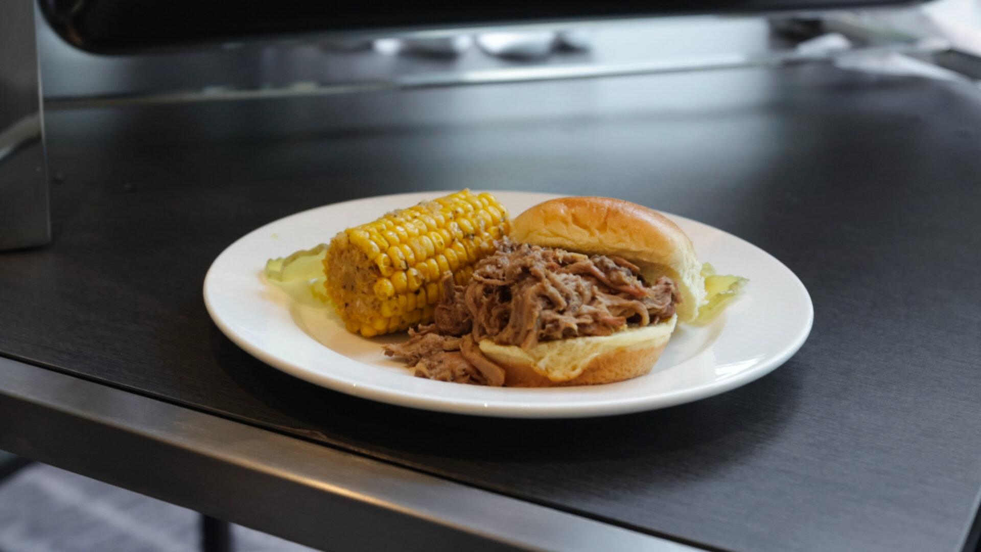 Mississippi smoke pulled pork and Cajun smoked corn by chef Michael Carr of Barbeque Shine, in Ridgeland, Mississippi.