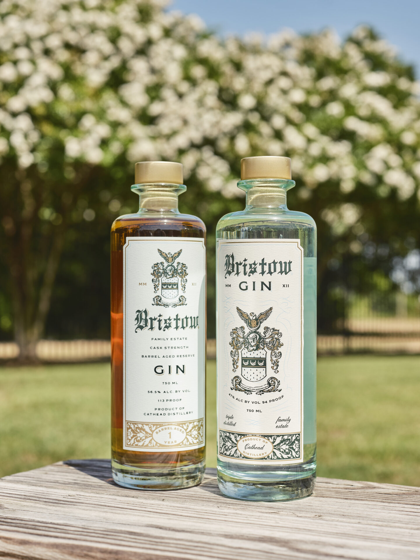 Bristow gin bottles by Cathead Distillery against a floral tree