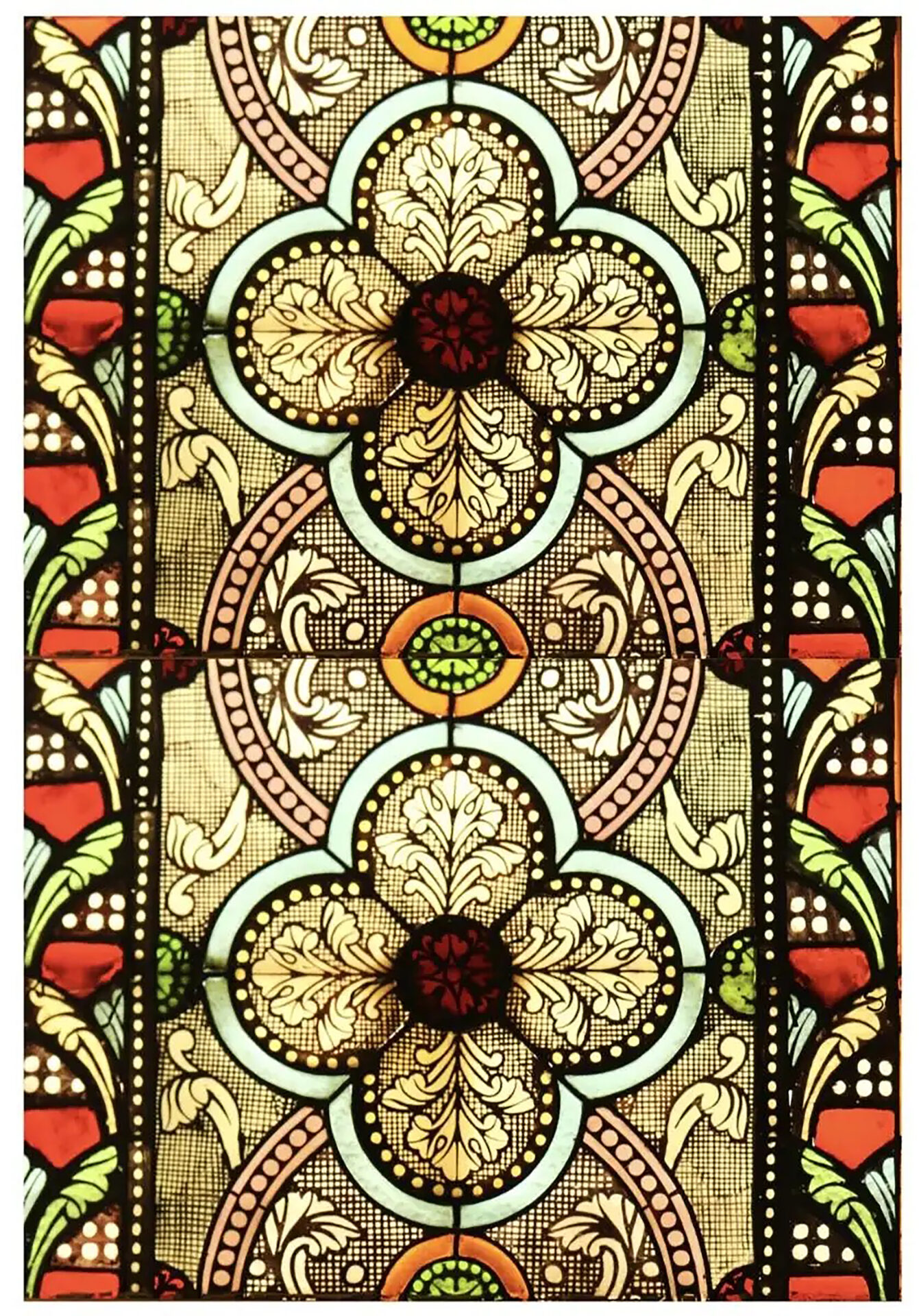 featured in the russell nashville, a Stained Glass Window with flowers and swirls in orange, green, and browns 