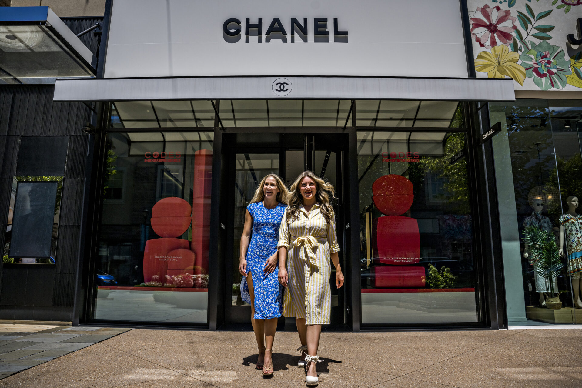 Two women walking out of Chanel at Avalon in Alpharetta, Georgia.