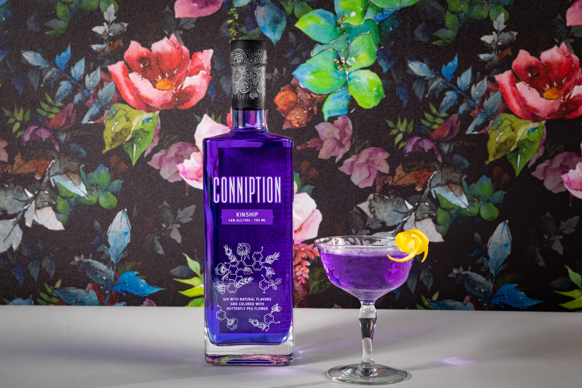 Conniption Gin Kinship with a brightly hued purple cocktail