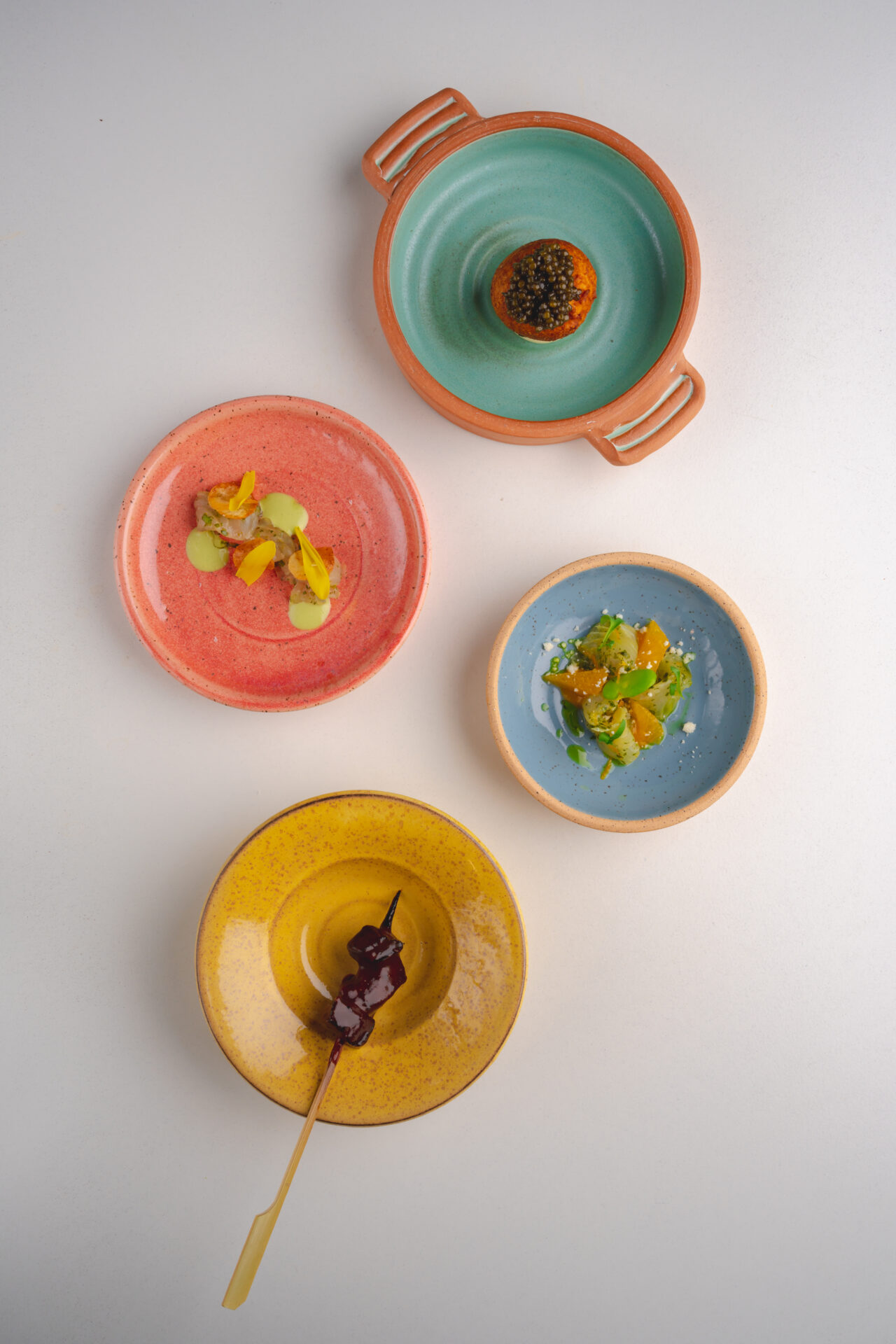 Street Food served on colorful plates at counter-