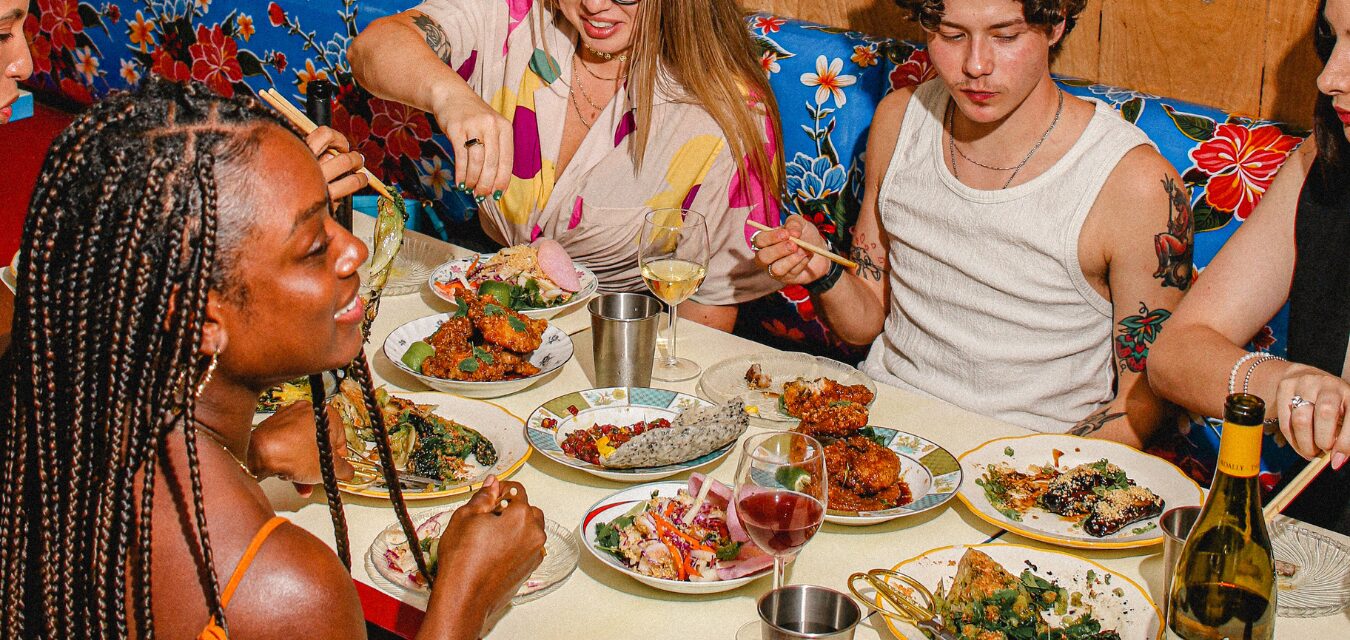 People enjoying food at a table at TÂM TÂM