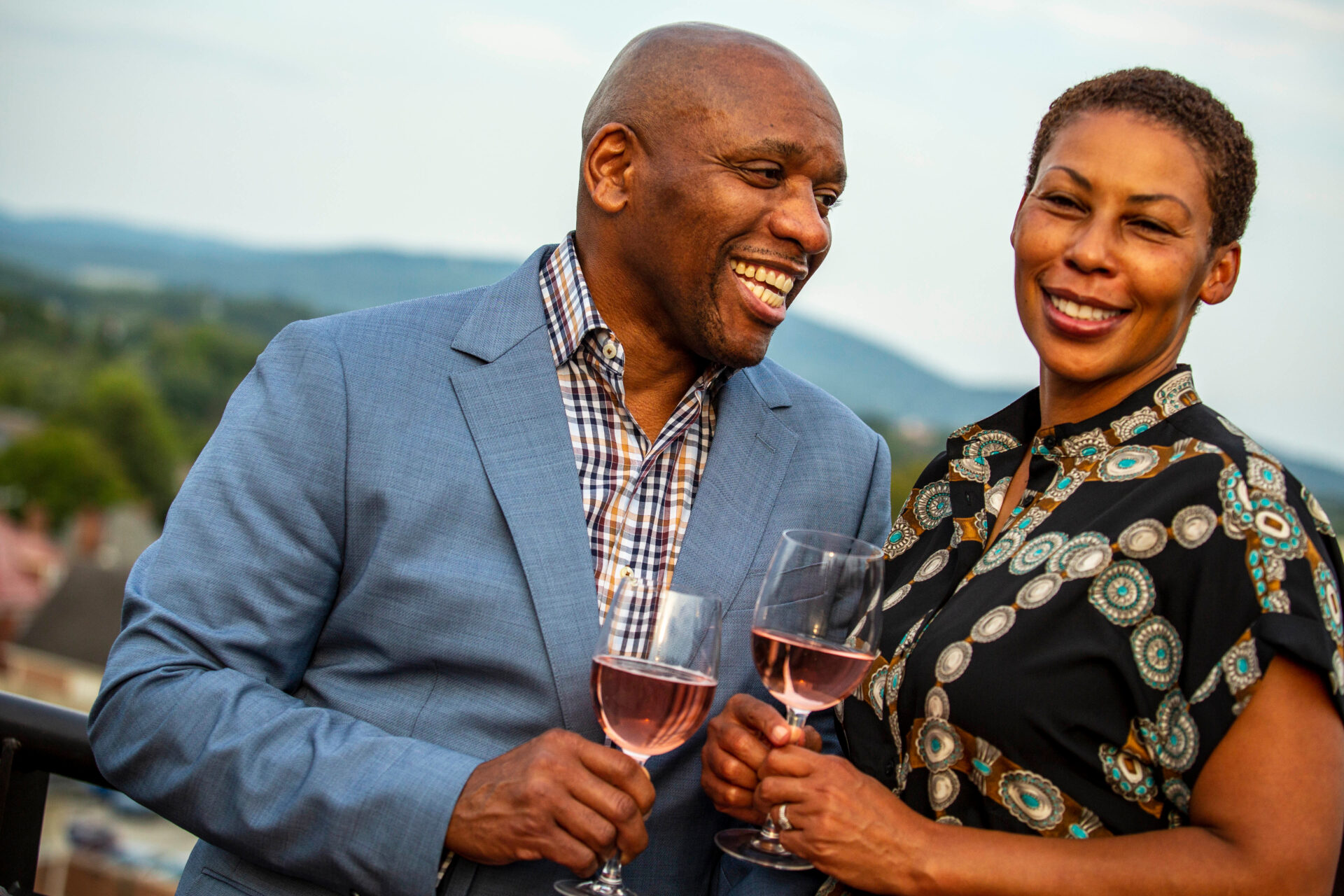 A man and women enjoying a glass of wine at a winery in Charlottesville. Virginia - the Wine Region of the Year. 