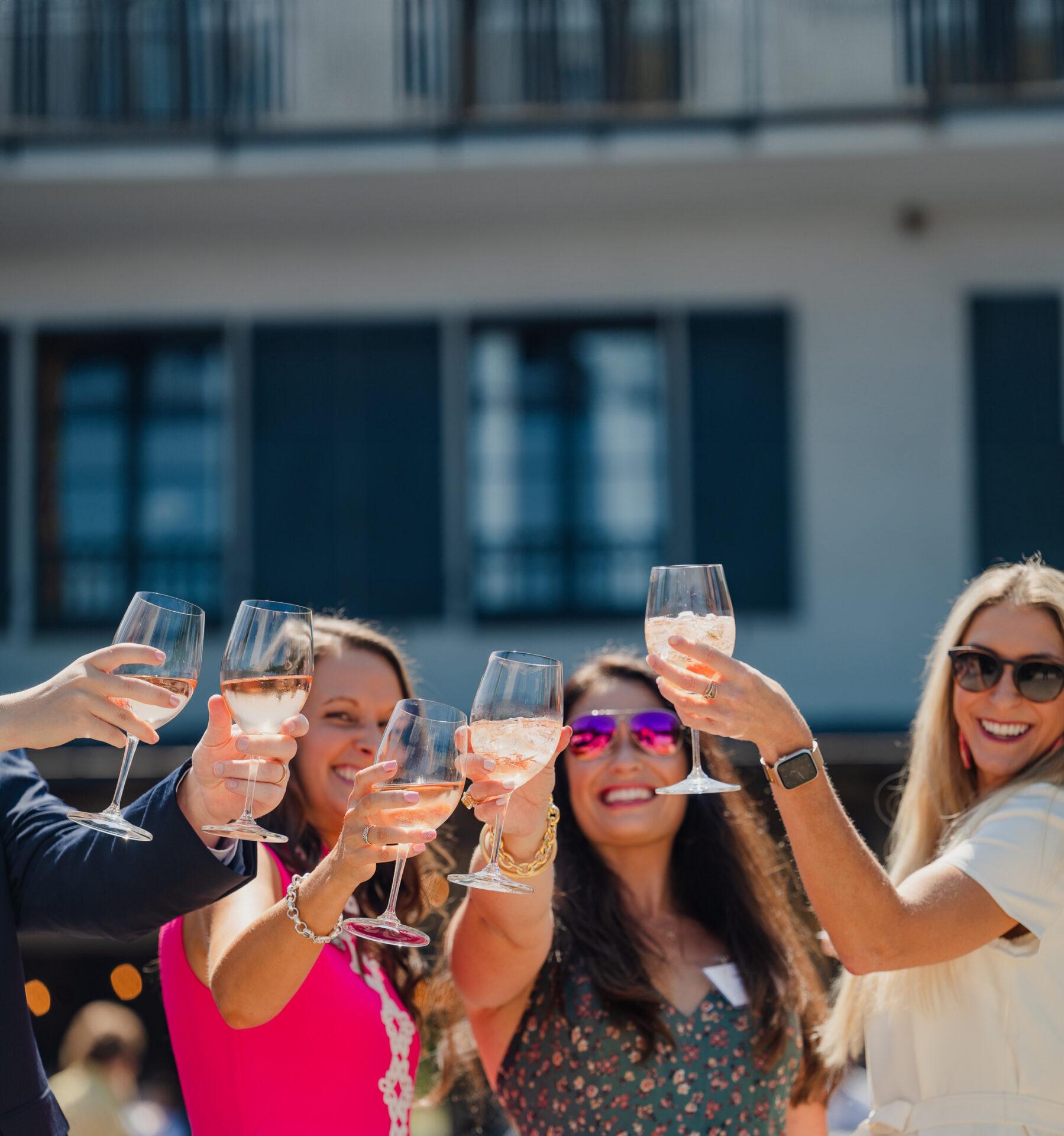 A group of women raise their glasses of wine for a toast at Euphoria. 