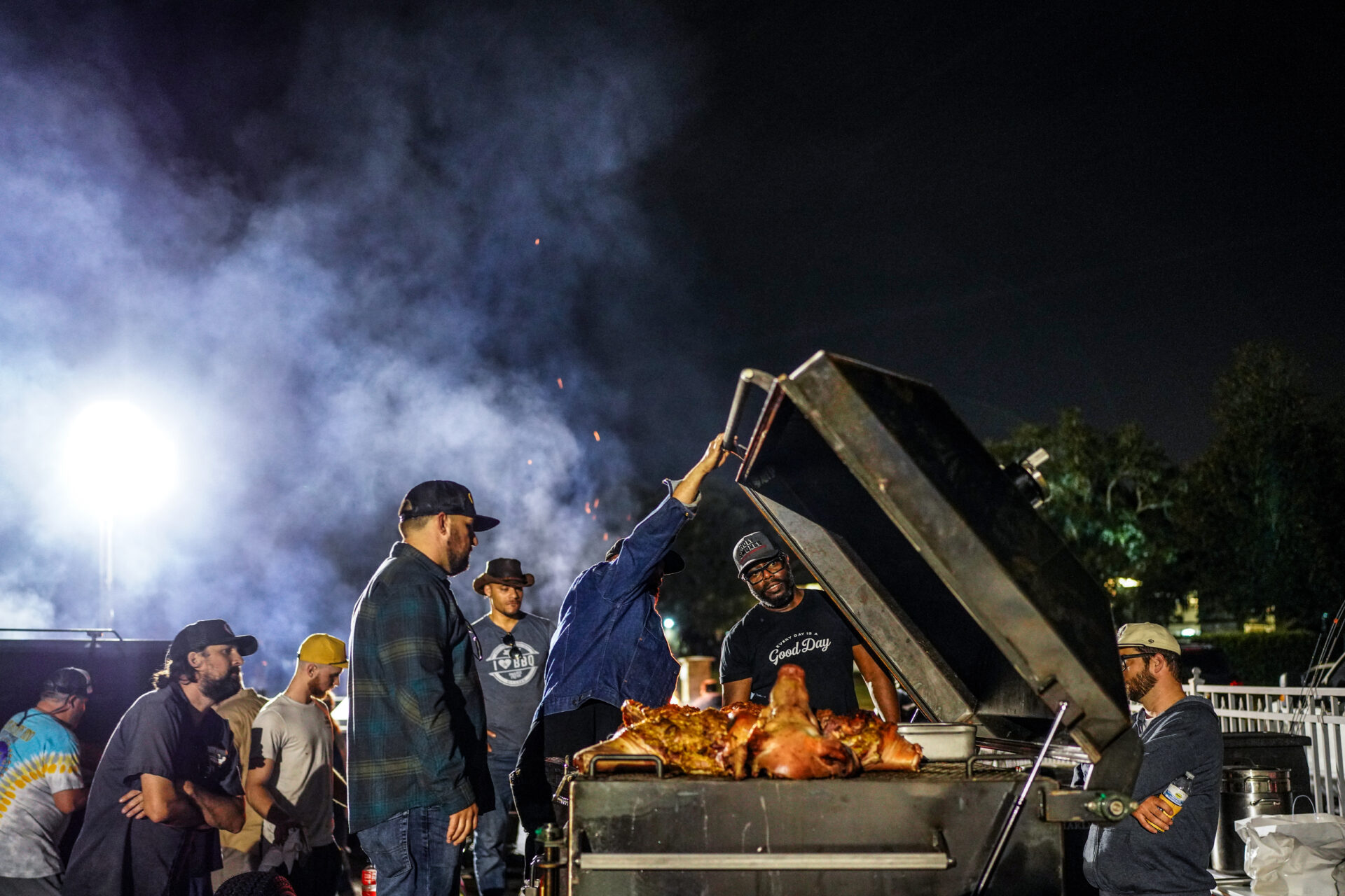 Rodney Scott and other pitmasters preparing barbecue.