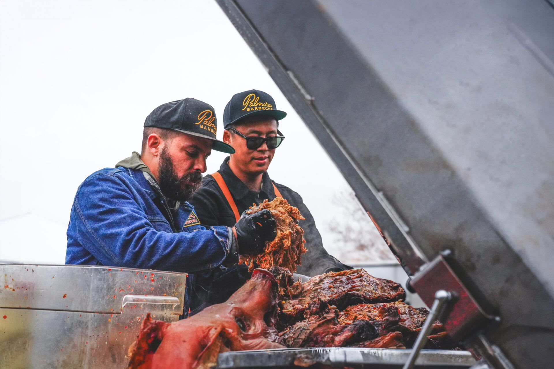 Hector Garate and Don Nguyen cooking at the grill.