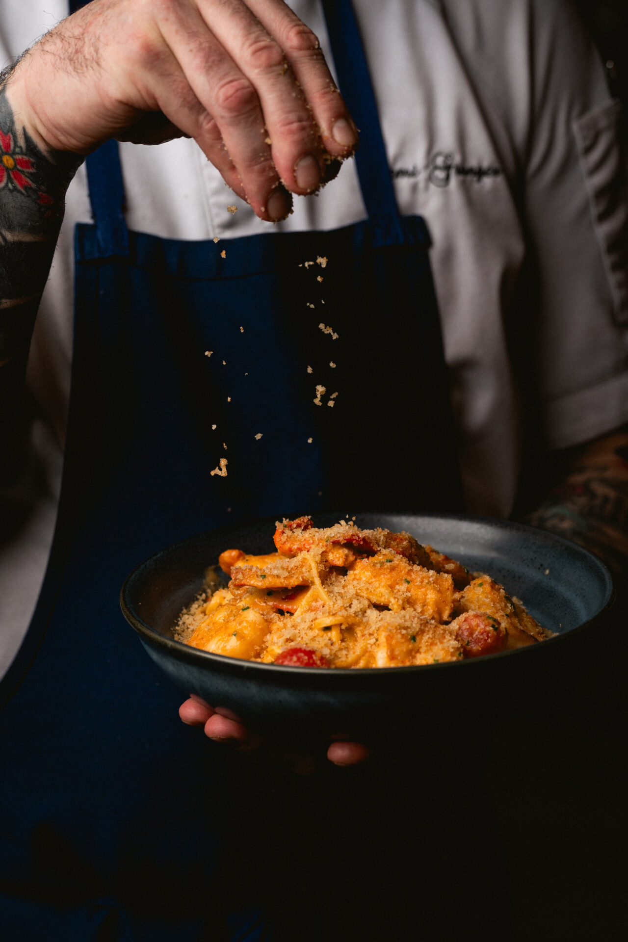 A dish being finished off with seasoning at The Select