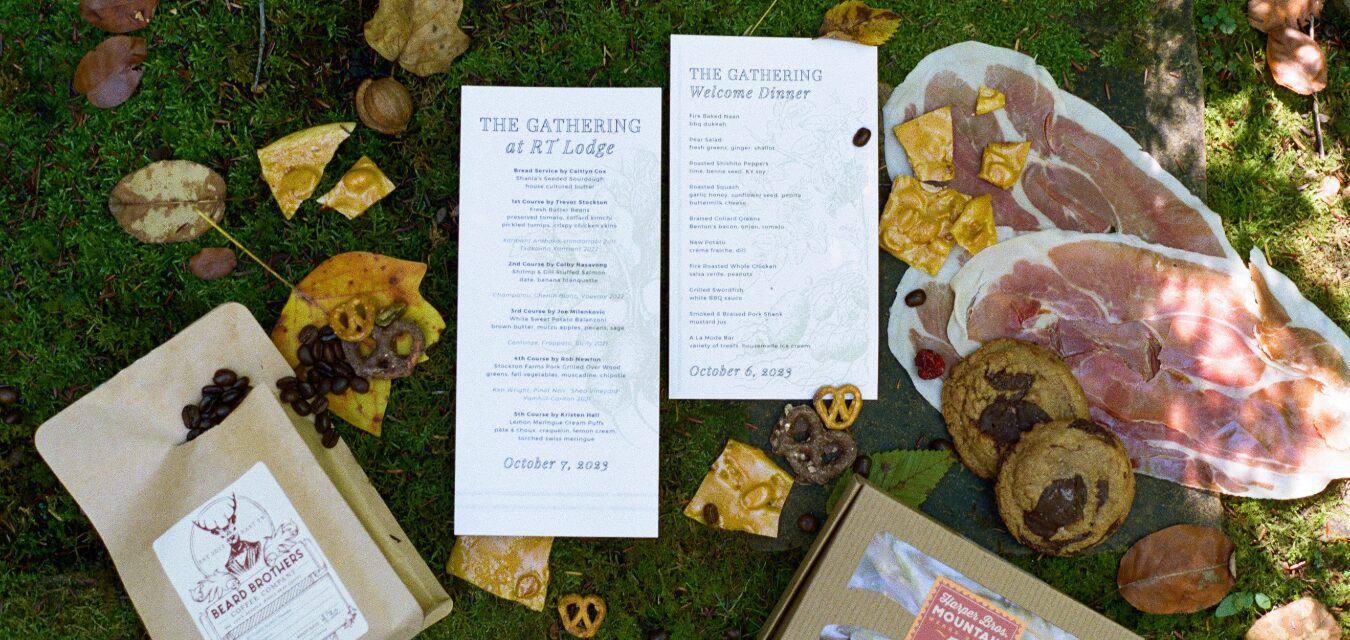 Menus and plates on grass for The Gathering at RT Lodge