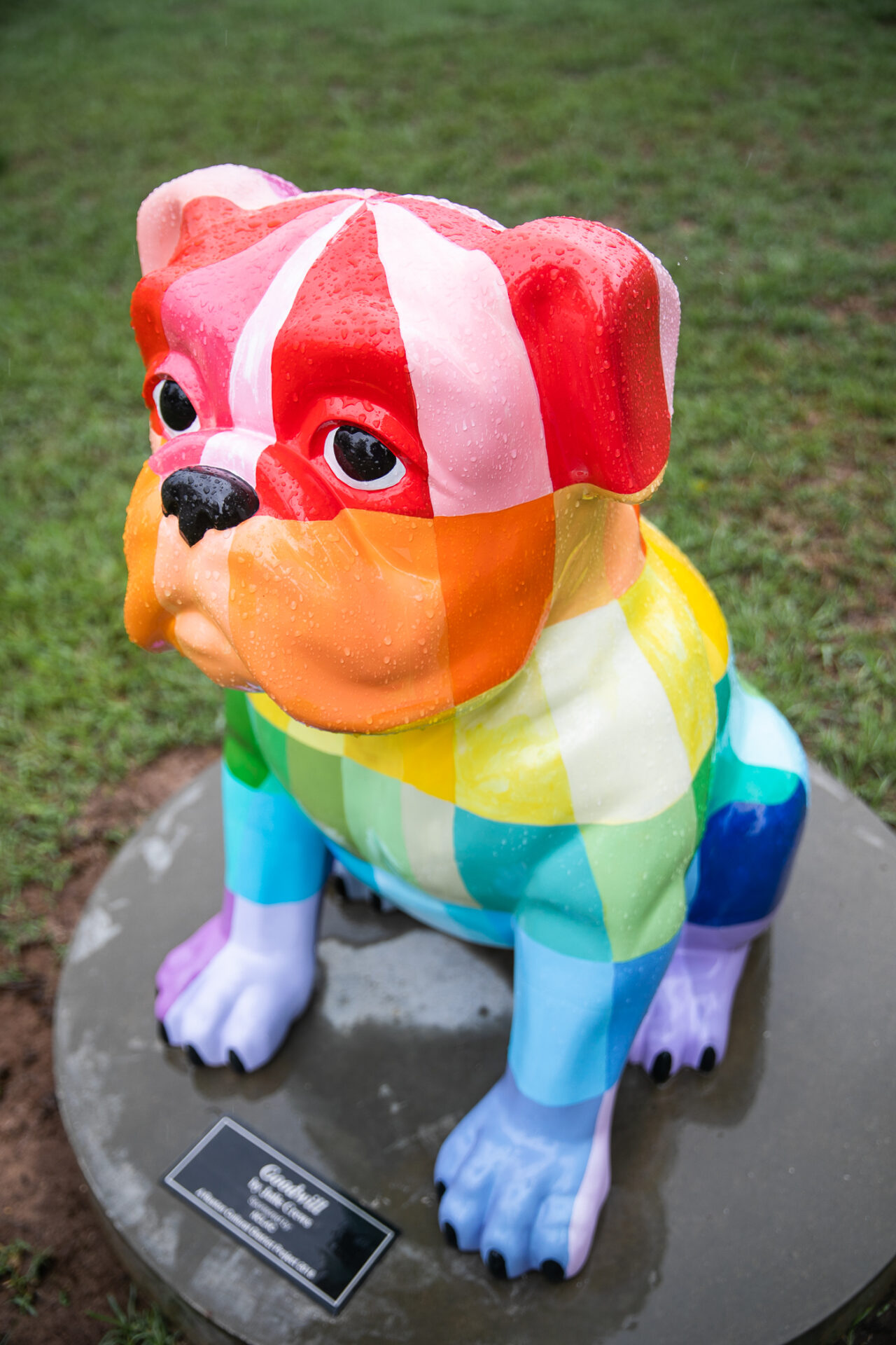 The Goodwill bulldog sculpture in Ruston features a multi-colored bulldog with rays of cascading colorful light.