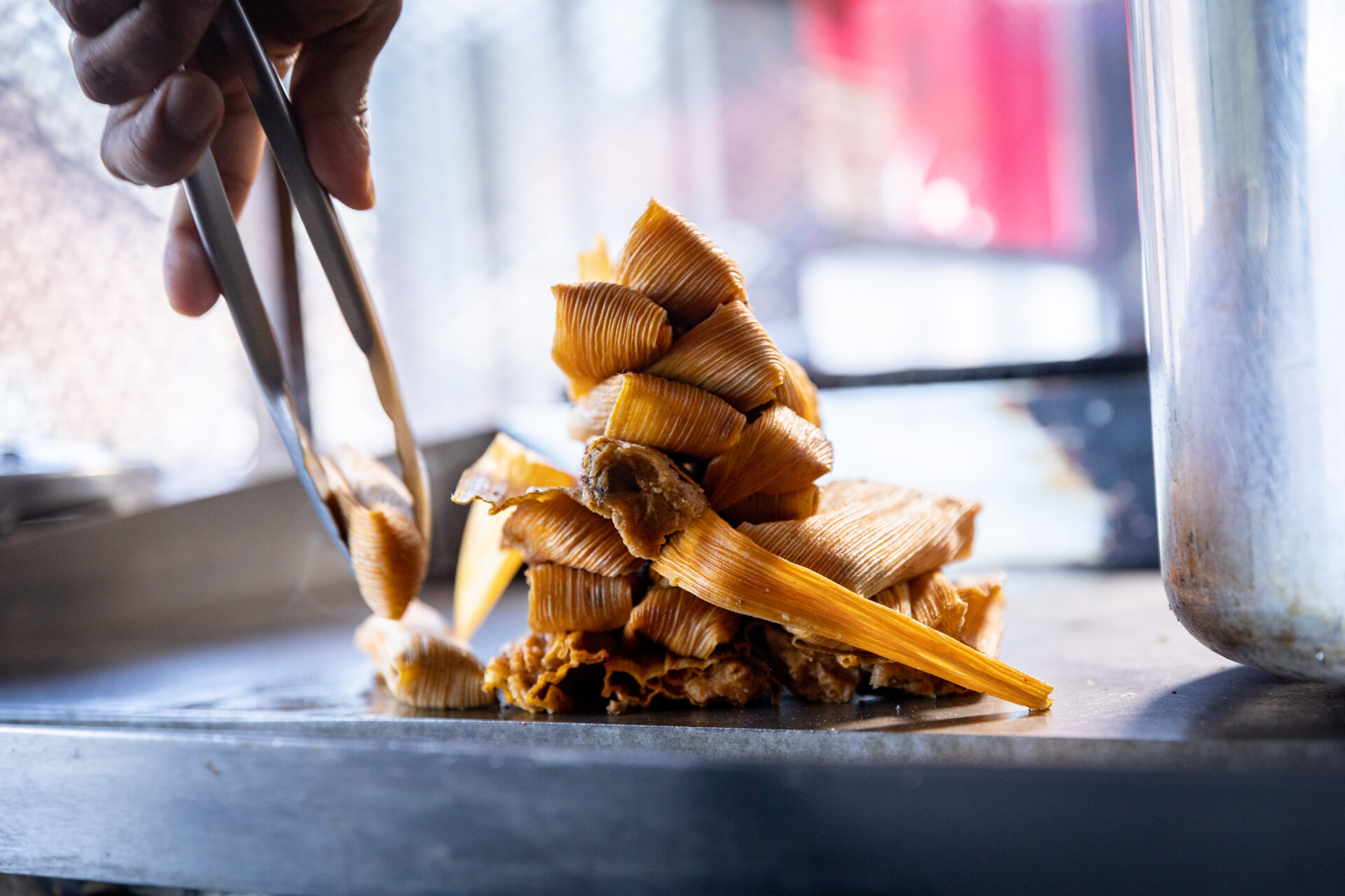 Pig ear sandwiches and homemade hot sauce at Big Apple Inn