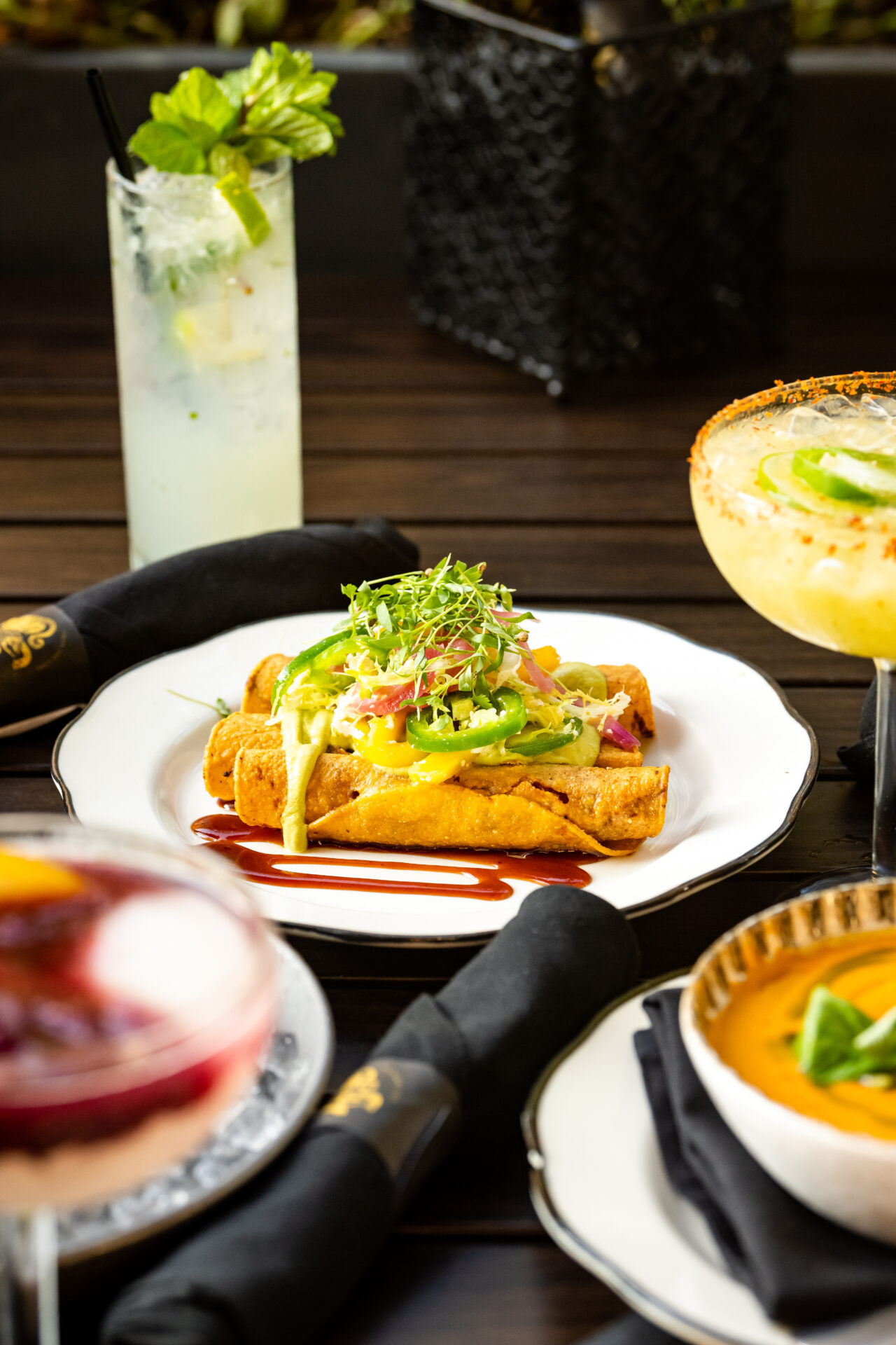 A plate of artfully decorated taquitos at a restaurant in Alpharetta, Georgia.