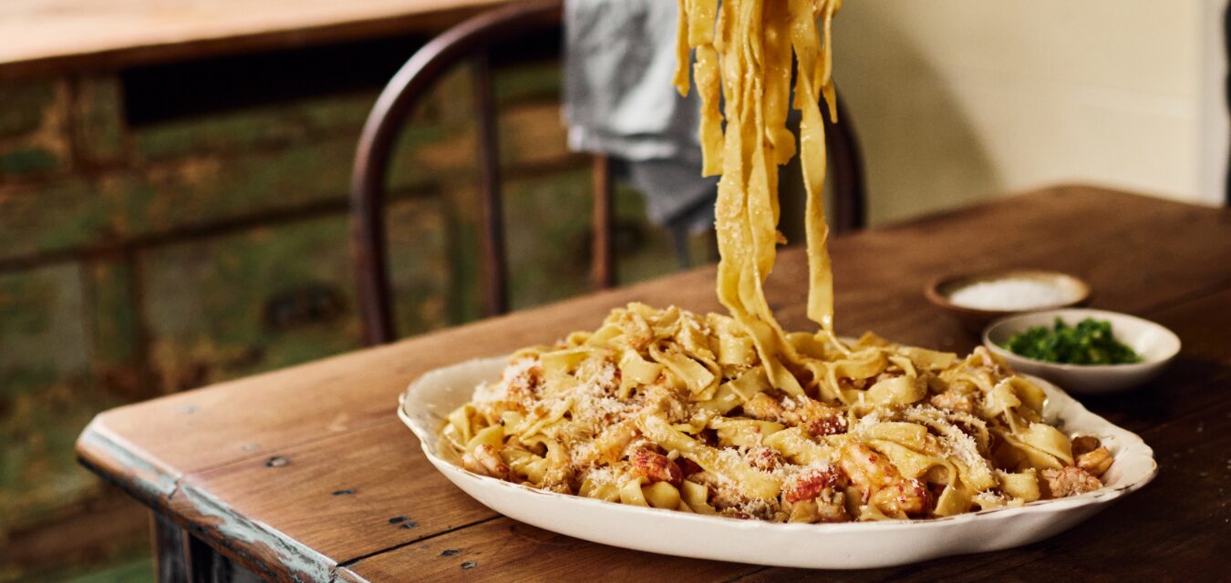 Fettucine falling onto a plate