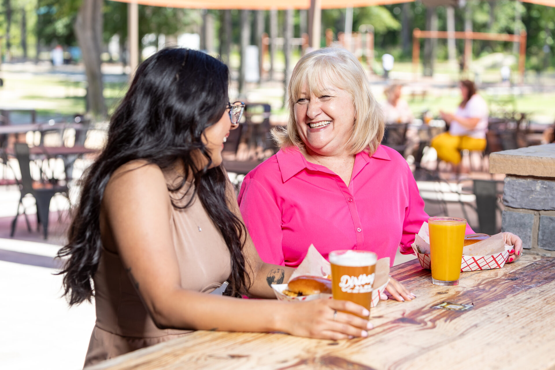 Two women enjoying a beer at Dirtbag Ales in Fayetteville, North Carolina