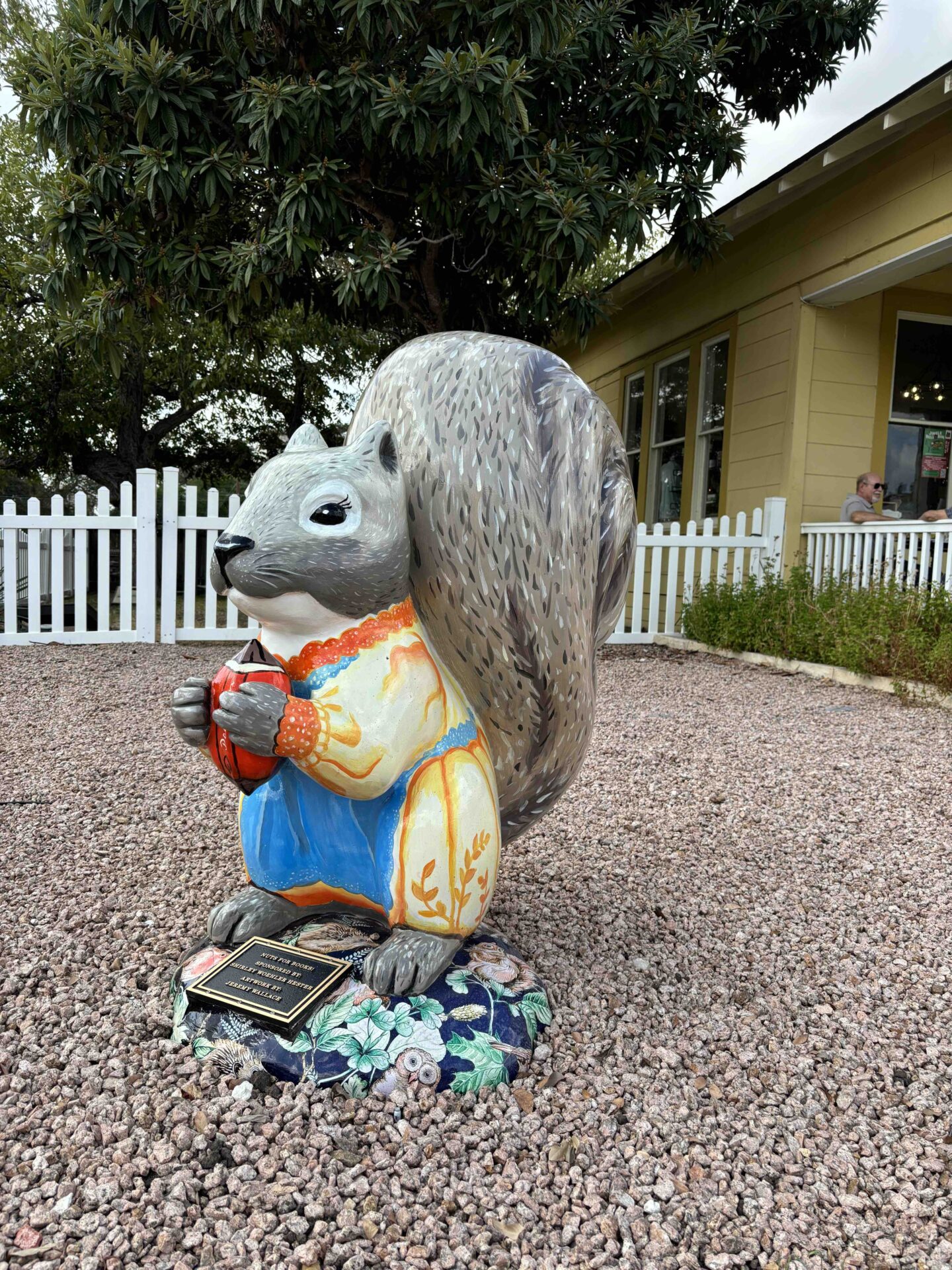 A squirrel statue outside of Pecantown Books and Brews in Seguin