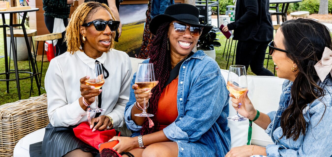 Group of women enjoying a glass of wine at the Charleston Wine + Food Festival.