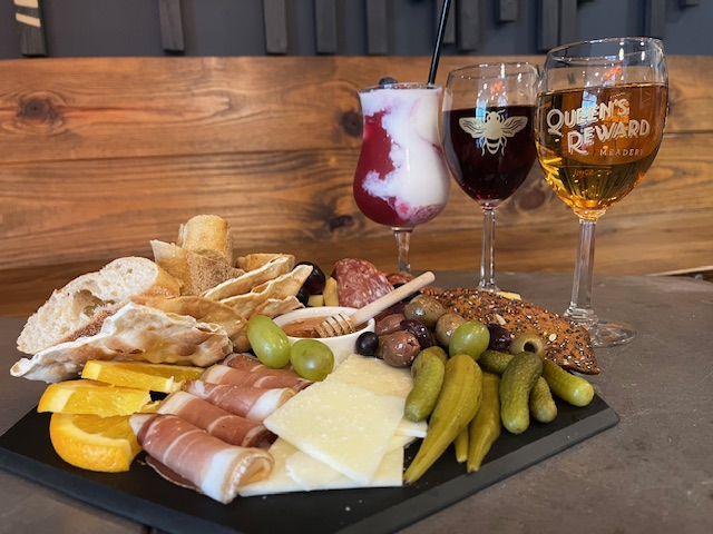 A charcuterie board with a variety of drinks at the Queen's Reward Meadery in Tupelo, Mississippi