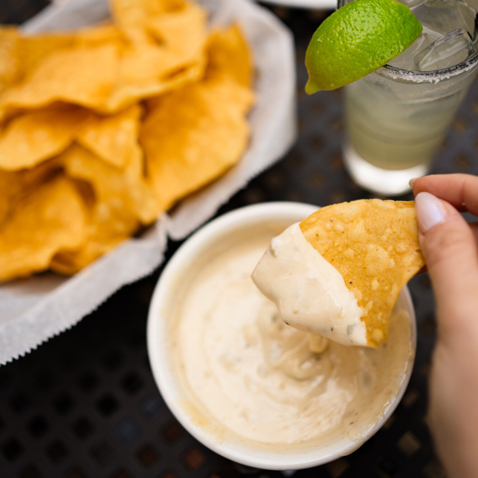 Chips and queso paired with a cocktail from Loca Luna in Little Rock, Arkansas