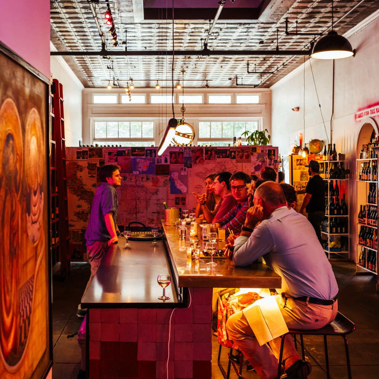 Patrons at the bar of Wild Child Wine Shop in Lafayettte, Louisiana