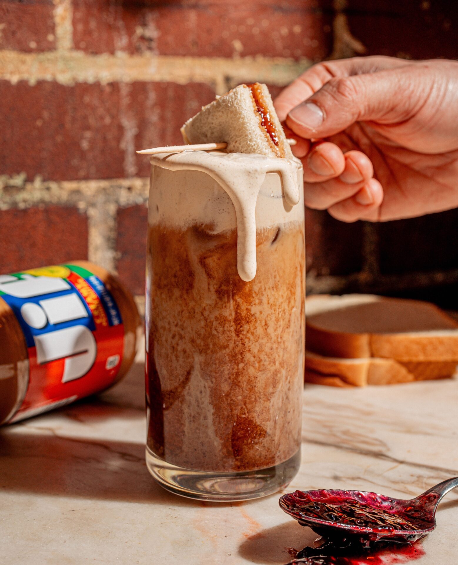 Oat milk PB&J coffe topped with peanut butter cold foam from Godspeed Cola