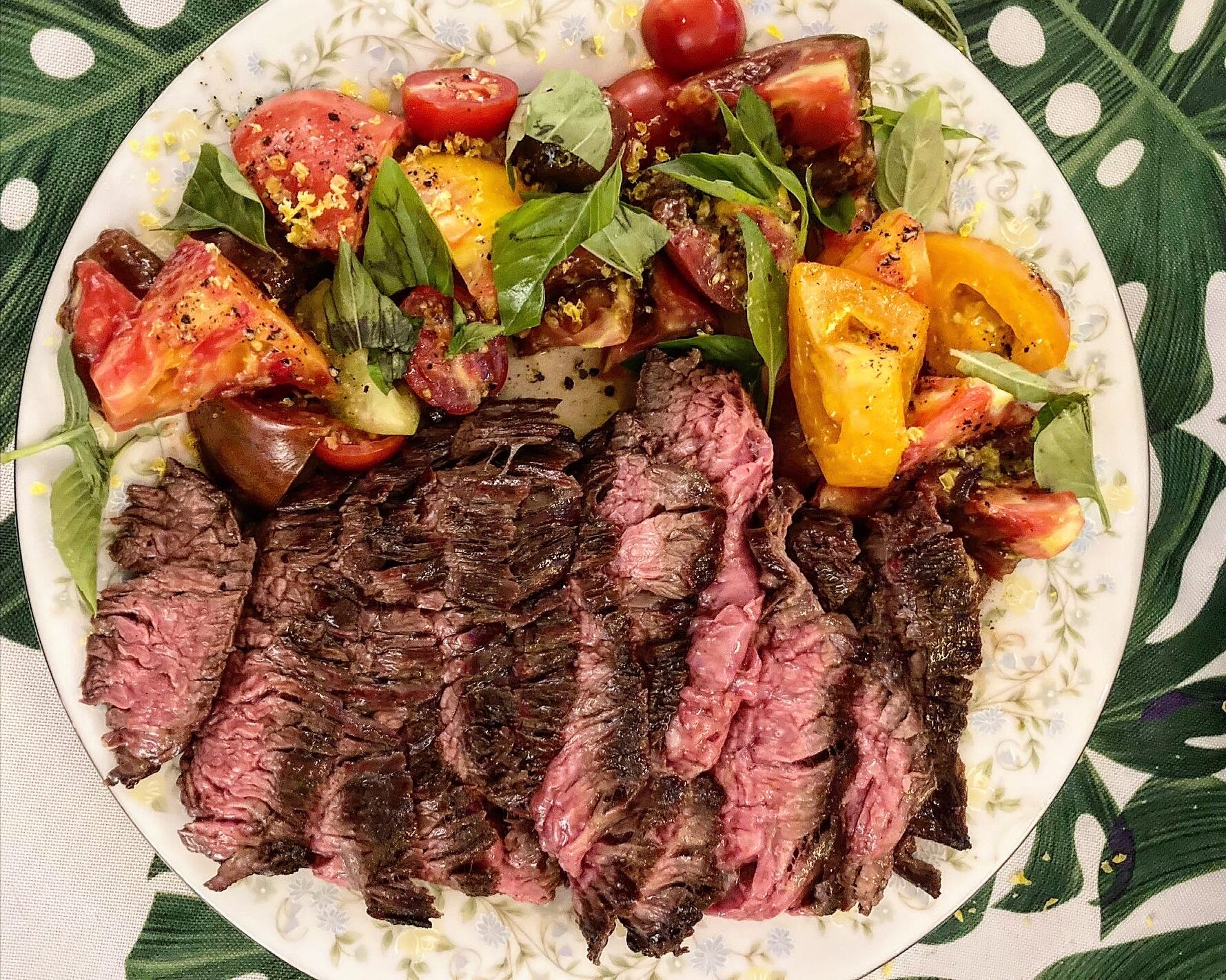 Plate of seared steak with tomatoes from the pop-up Hem and Her