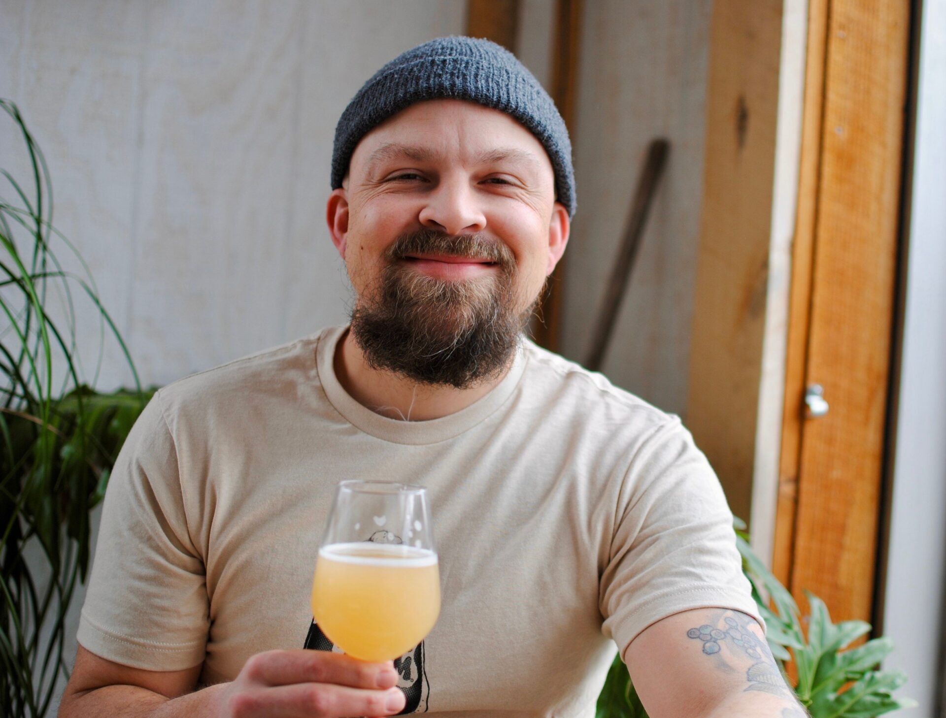 Tyler Wert of Blindhouse Beer holding a craft beer