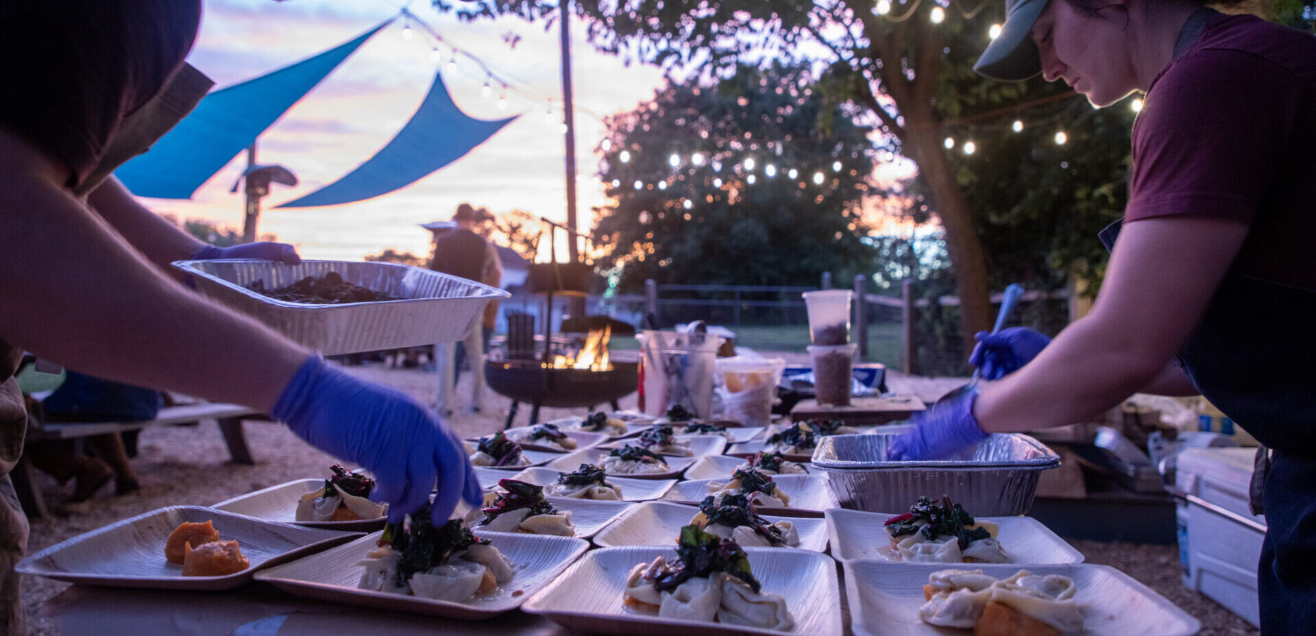 Jordan Rainbolt of Native Root plating dishes at a pop-up event