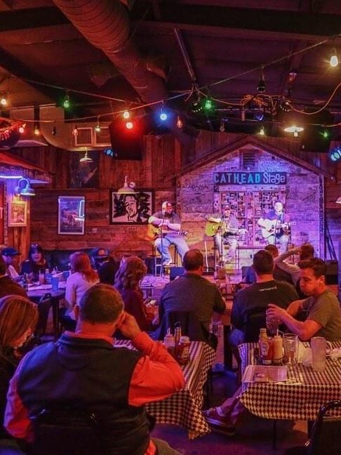 A band playing and large crowd at Mississippi music venue, Blue Canoe in Tupelo.