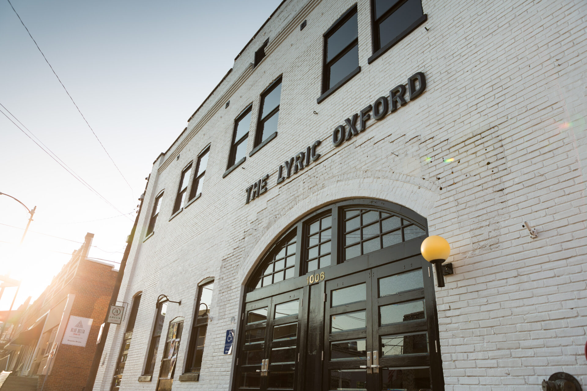 The Lyric is a music venue in Oxford Mississippi with a modern, white exterior.