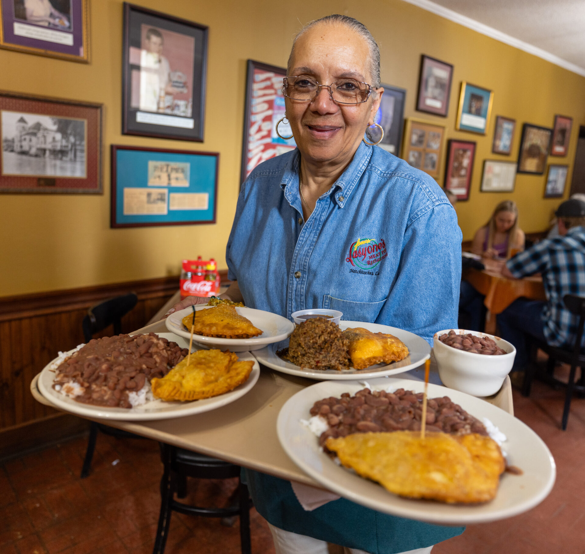 Marilyn Demars, former longtime employee of Lasyone’s, serves pies with a smile