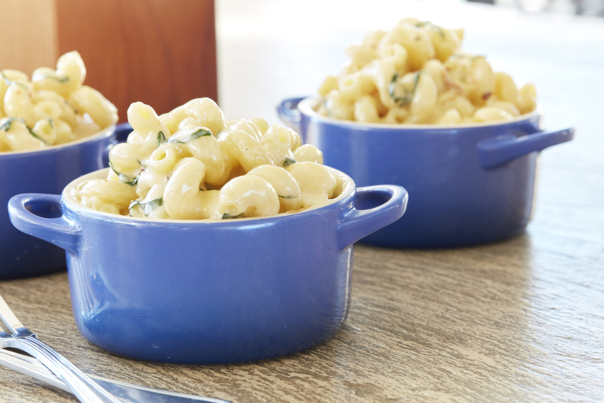 Award winning Four Cheese Macaroni is glistening and topped herbs at Osprey Point Clubhouse's Cherrywood BBQ and Ale House in Kiawah Island, South Carolina.