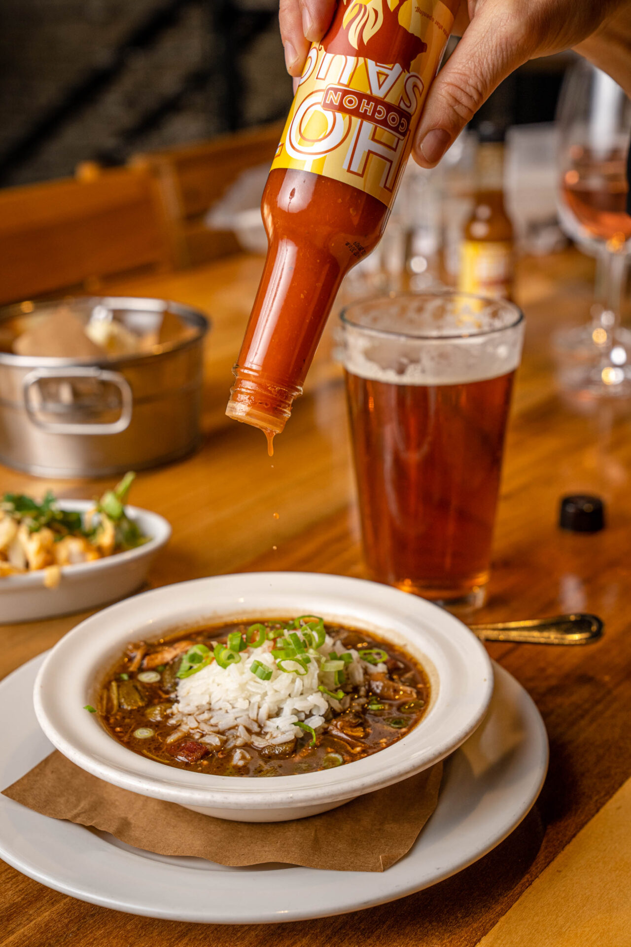 Cochon hot sauce on gumbo Louisiana