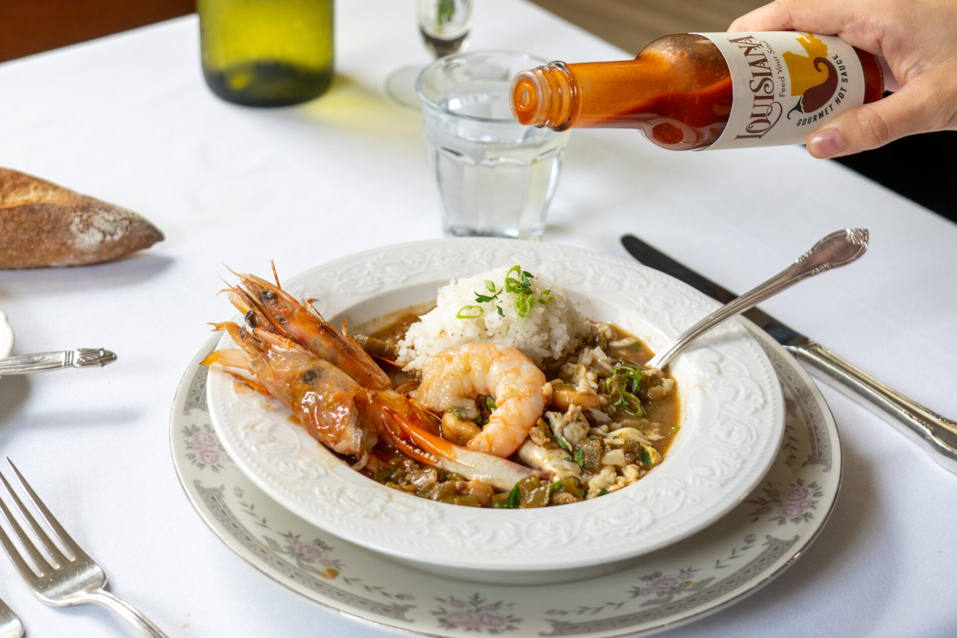 Louisisana Hot sauce on shrimp gumbo dish