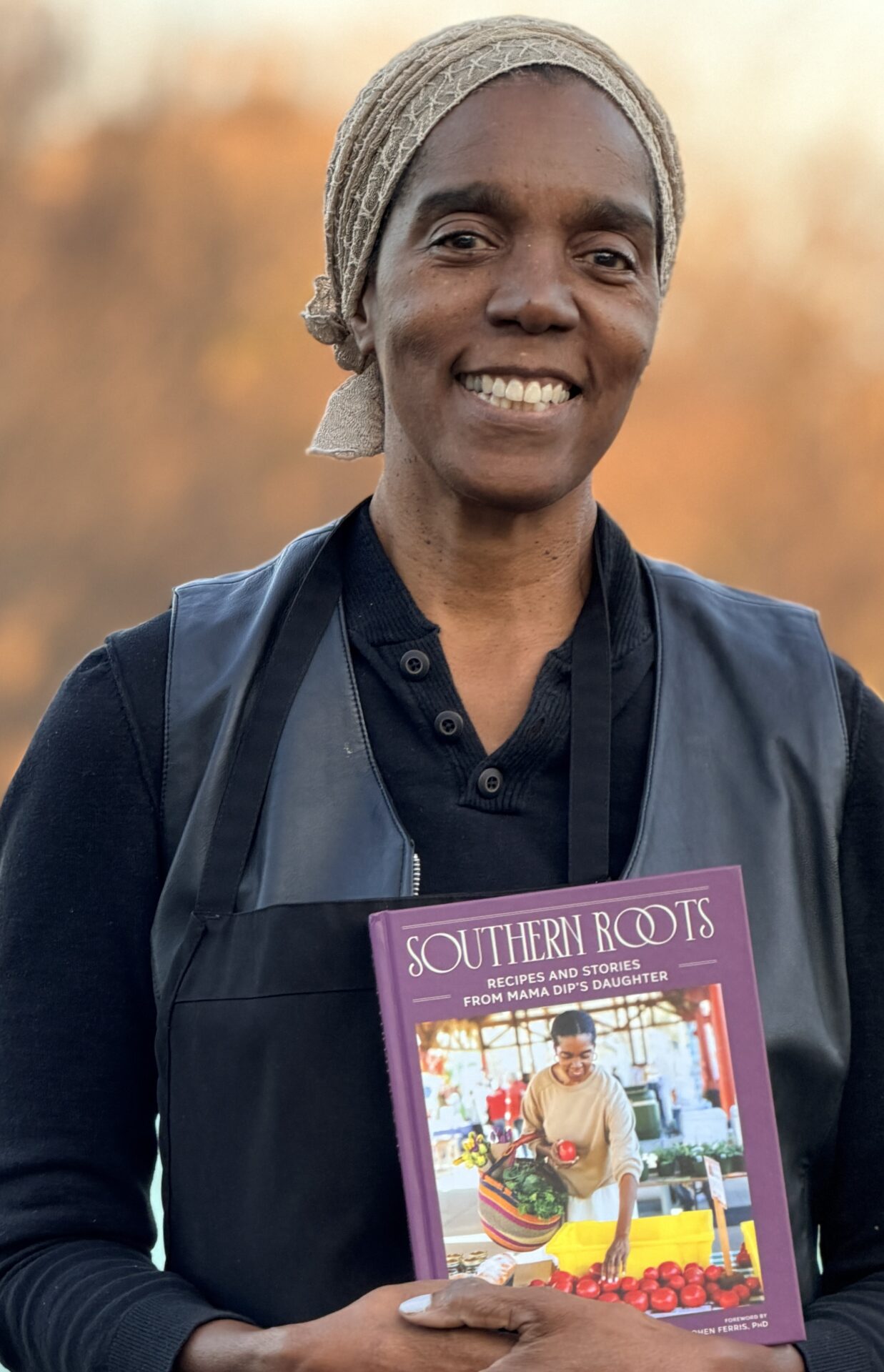 Spring Council headshot with cookbook
