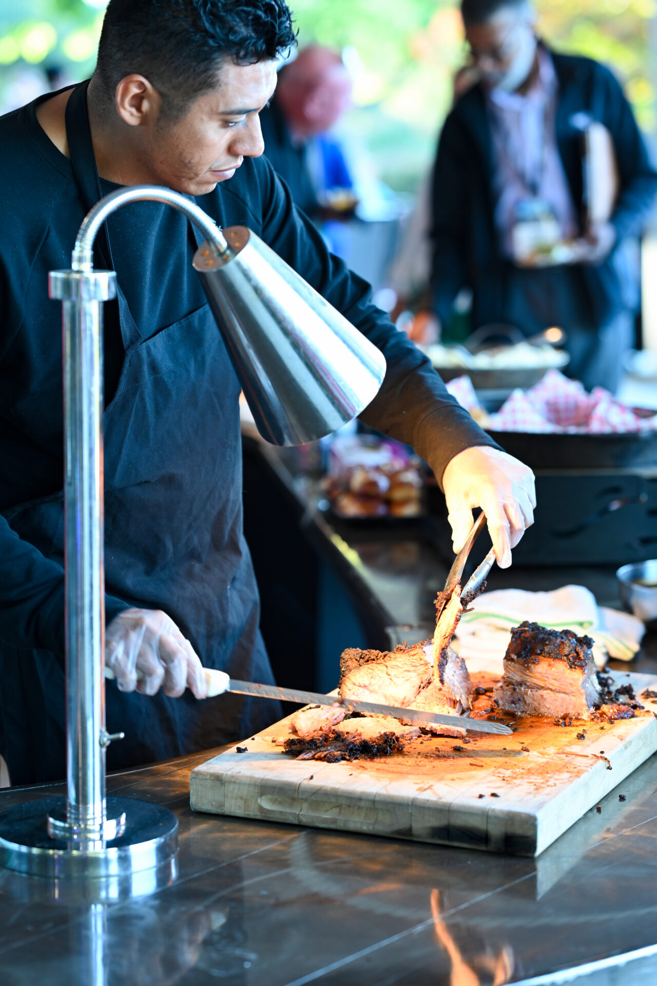 a man slicing meat in Little Rock AK