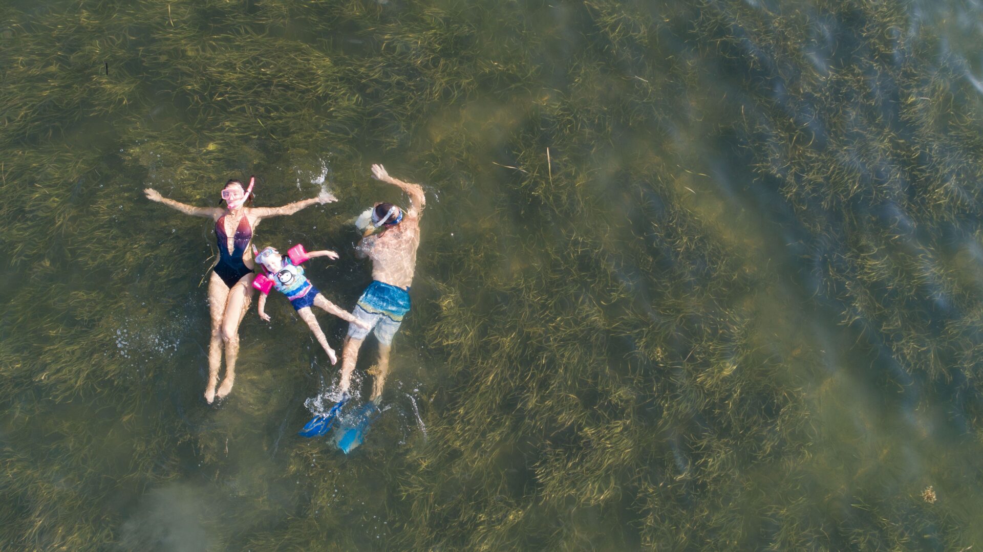 family floating in water in Florida