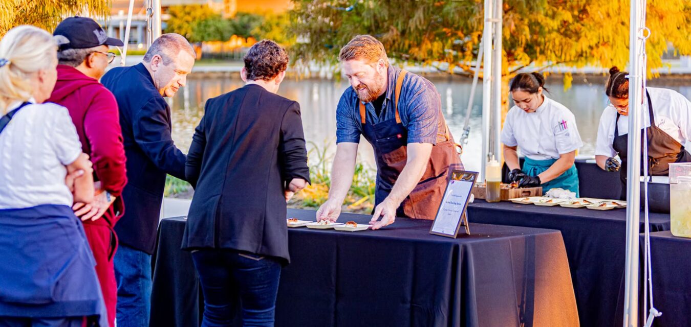 man serving food at SHEF Food and Wine Festival