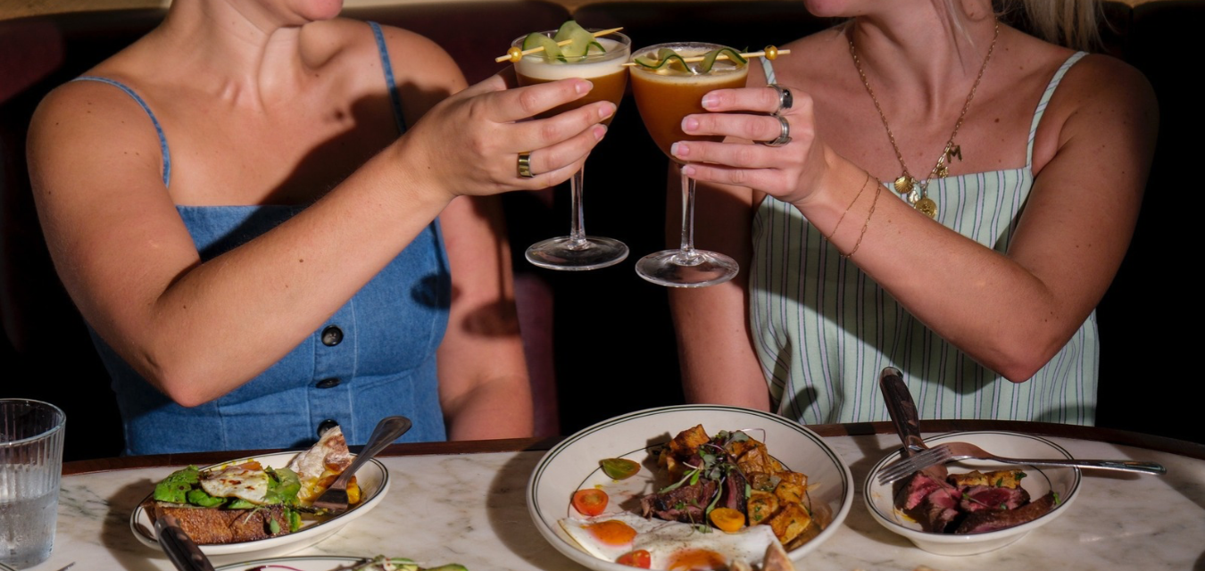 two women with a bloody mary martini at by the way